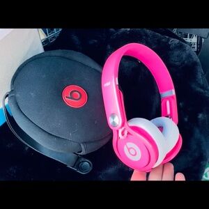 Bright pink Beats headphones (not cordless) with case